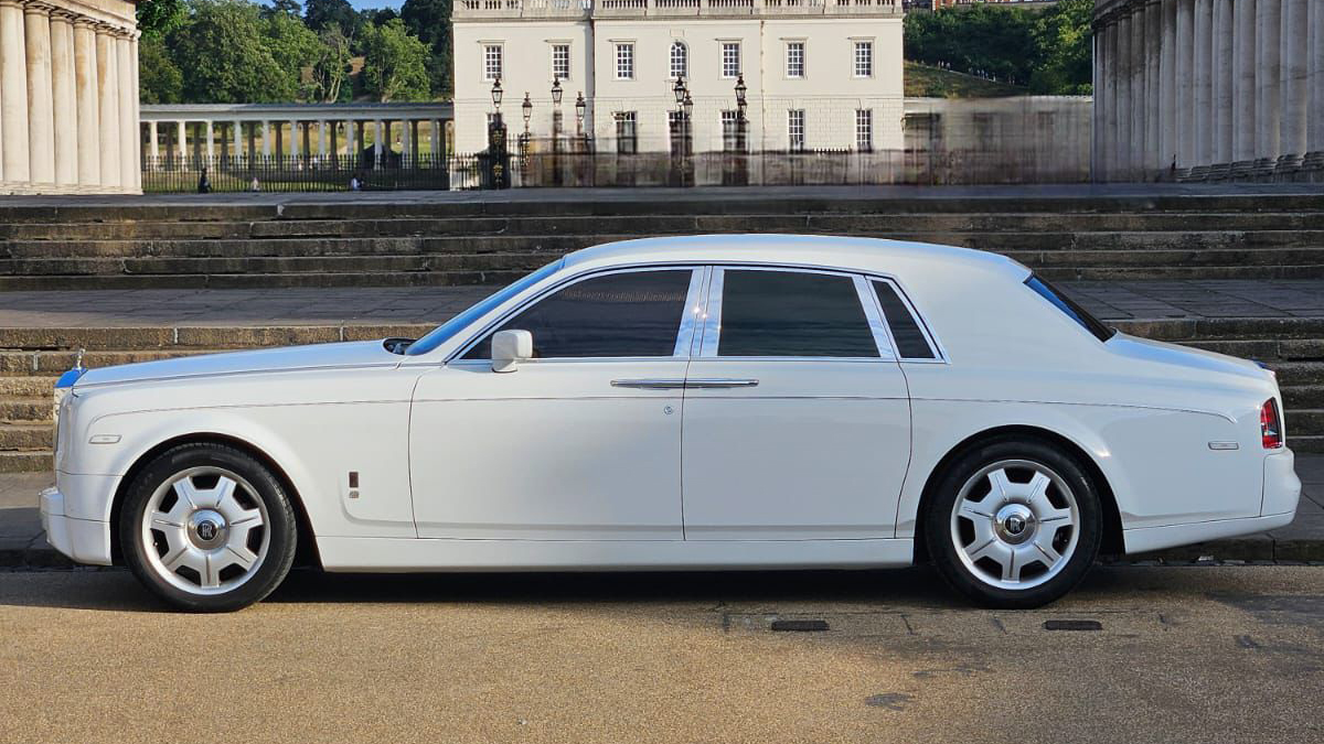 Left side view of White rolls-Royce Phantom parked in London