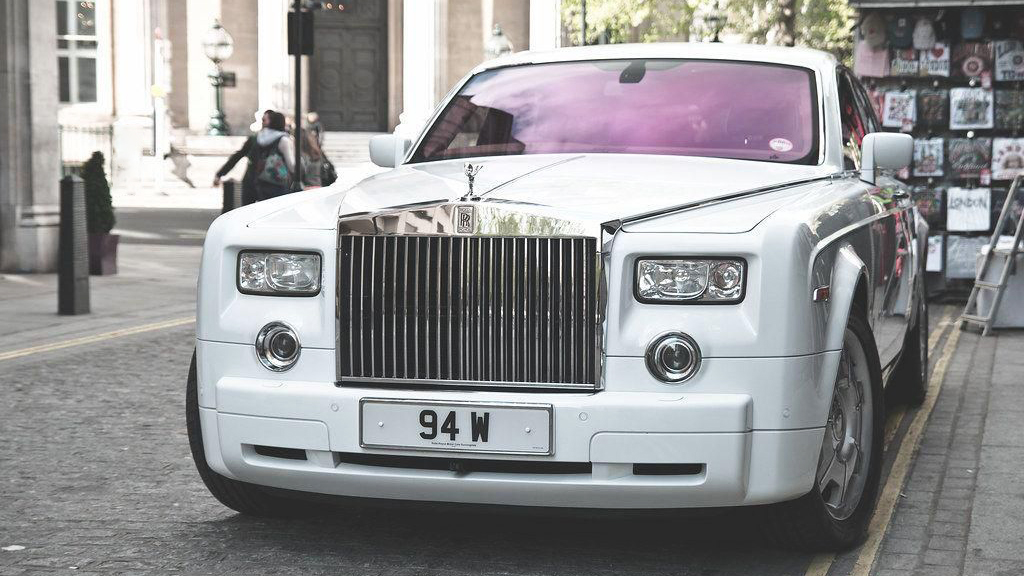 White Rolls-Royce Phantom paqrked in the street of London