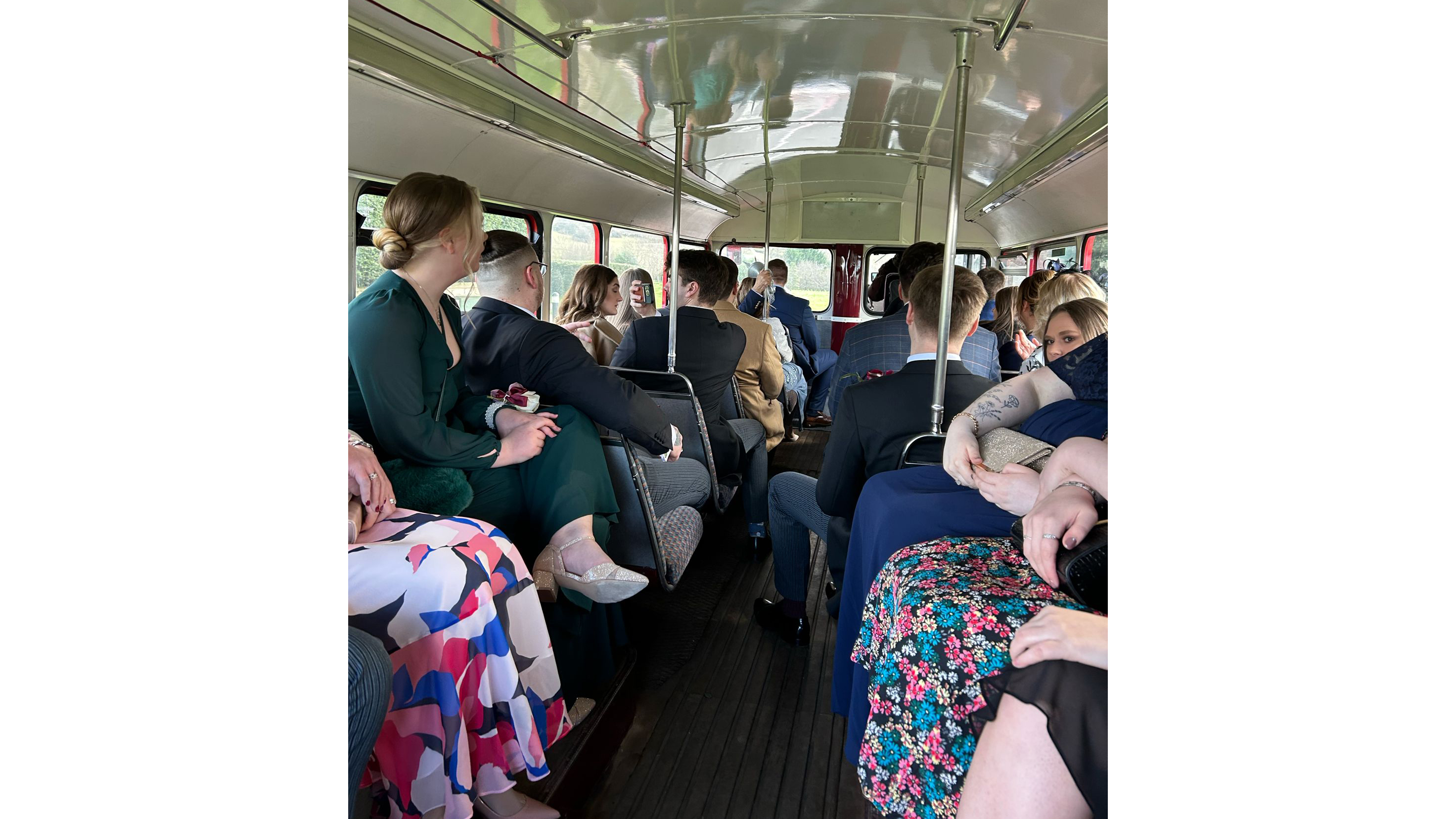 Wedding guests seat inside the Routemaster bus.