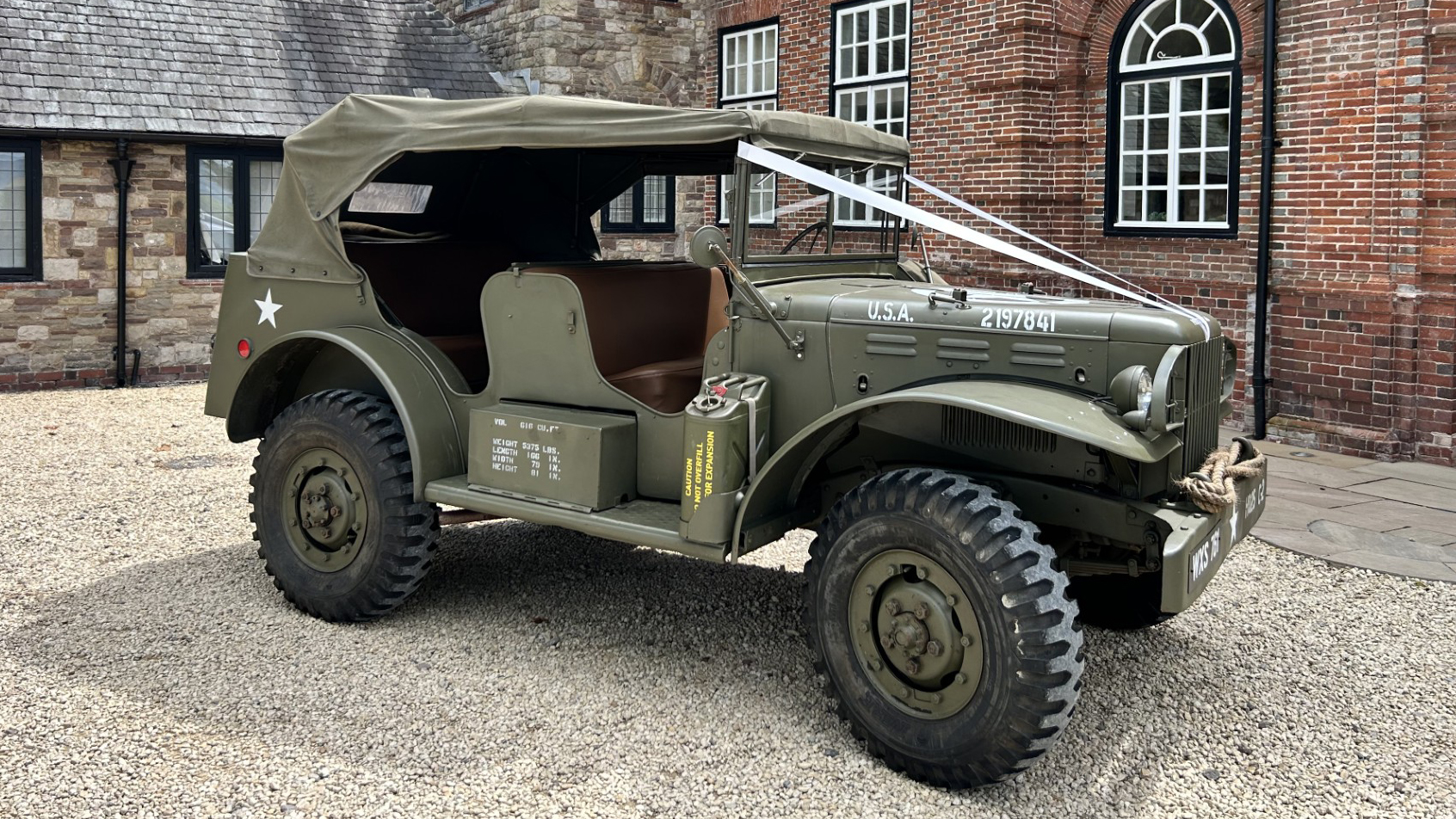 Khaki Green Ex-militaty Dodge Command Car decorated with white ribbons and Khaki green canvas on top