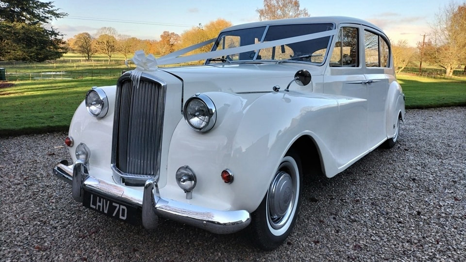 Austin Princess Limousine decorated with white ribbons