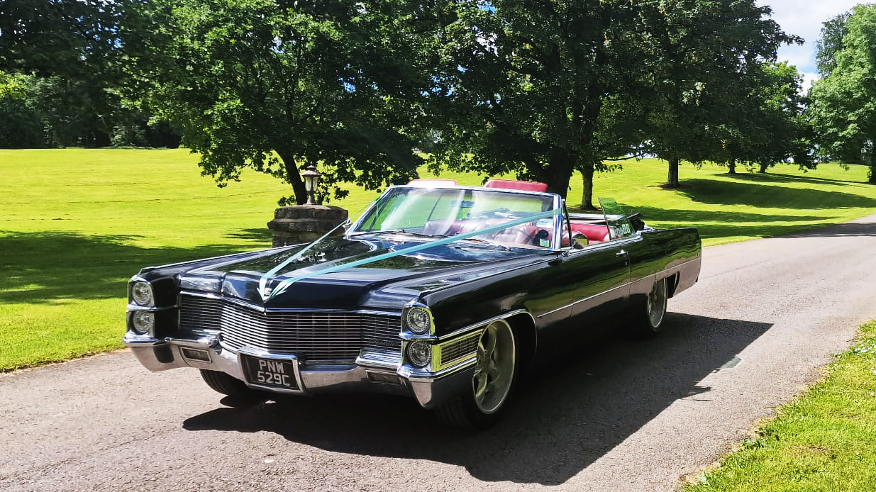 Black Convertible American Cadillac with Light blue ribbons