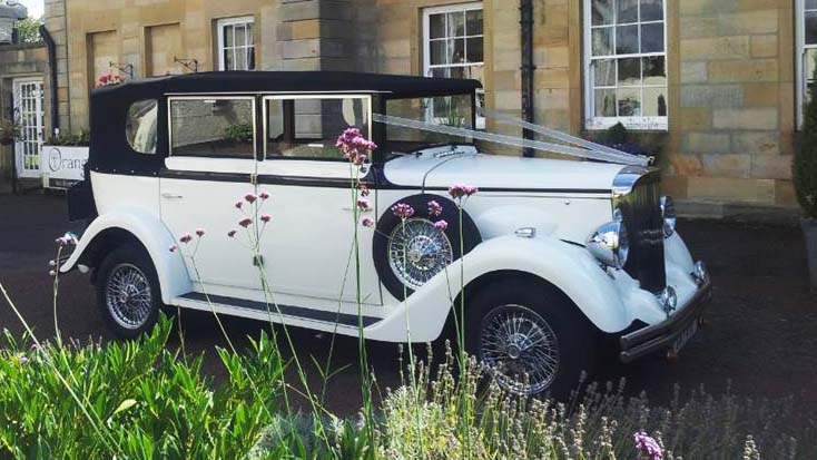 Regent Convertible in front of wedding venue