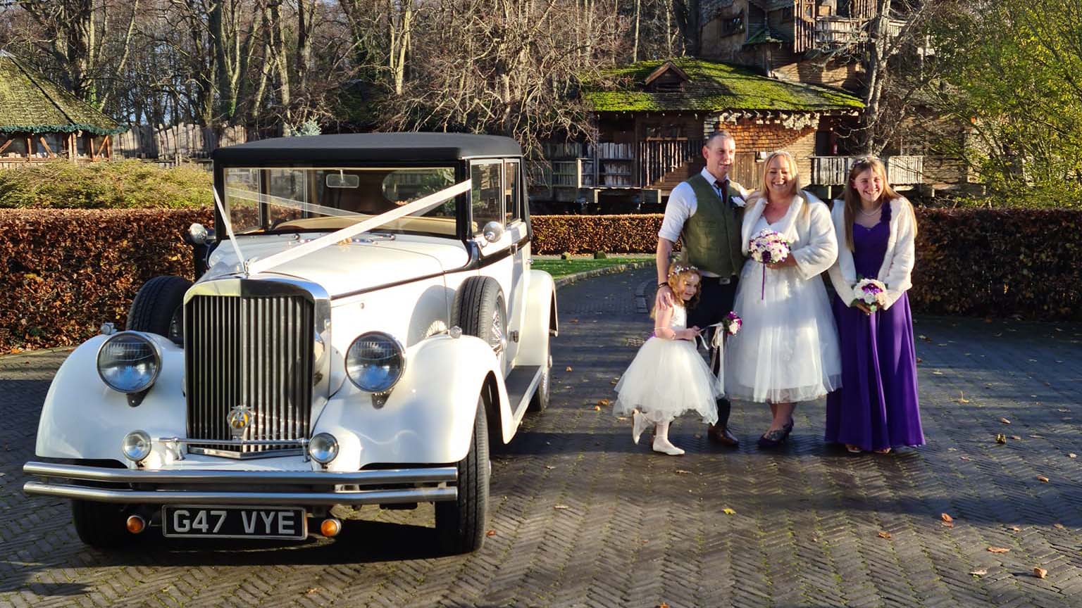 Regent Convertible with Bridal party standing next to the vehicle