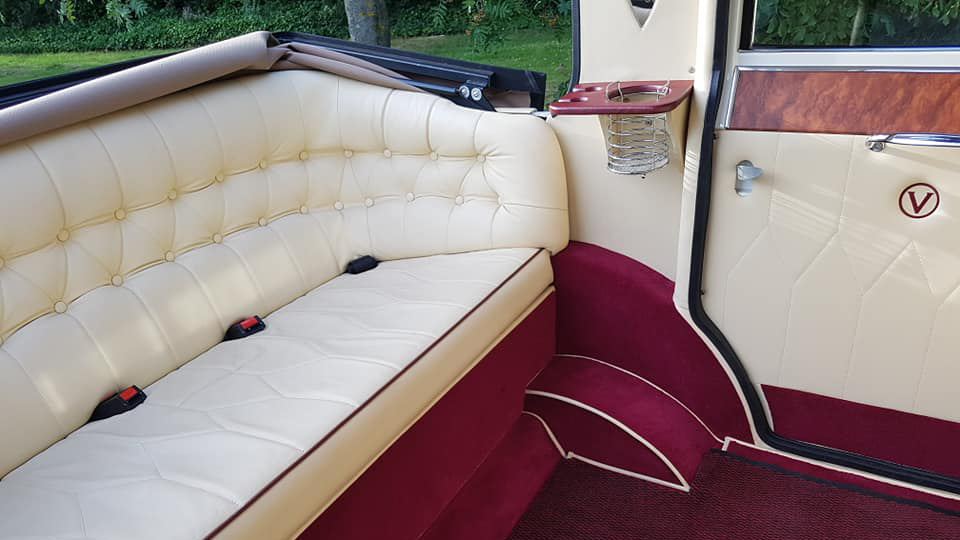 Cream leather rear interior seats with Burgundy carpet and semi convertible roof open