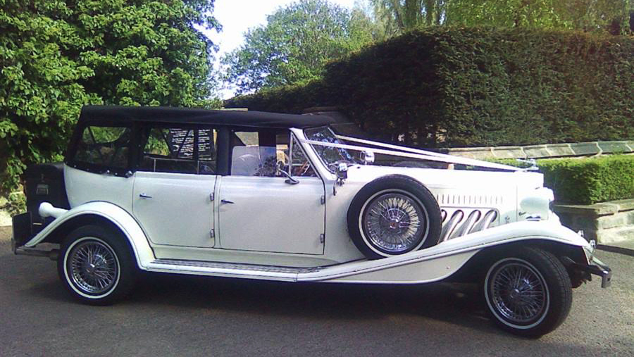 Beauford Convertible right side view with spare wheel mounted on the skirt of the vehicle