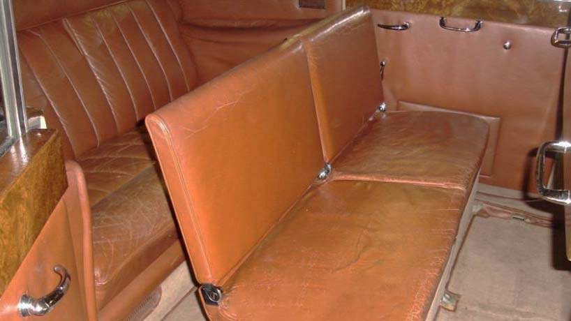 rear interior seating are with Tab Leather rear bench seats and two casual middle seats raised up for additional seating.