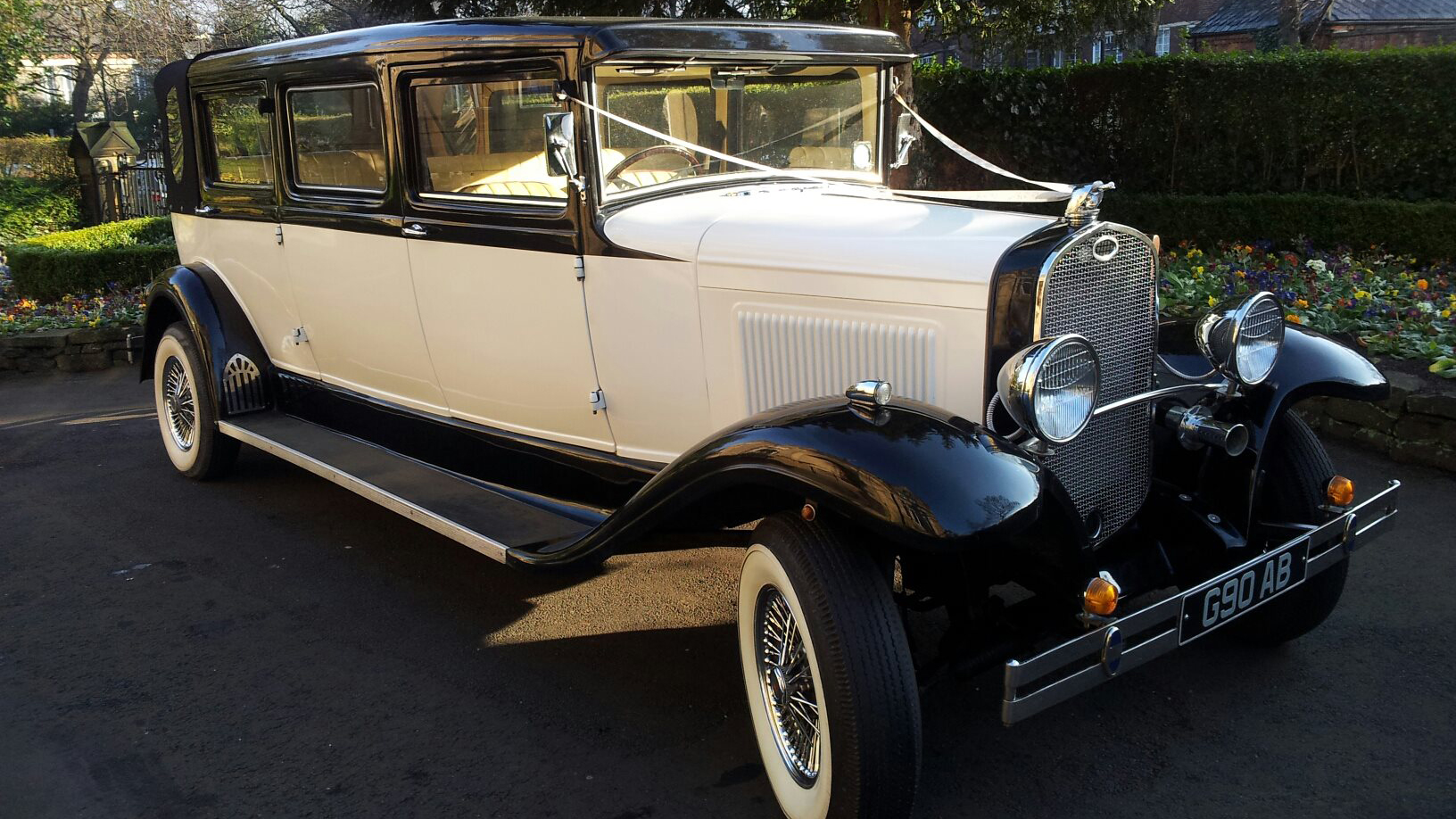 Bramwith Limousine with ivory ribbons accross its bonnet