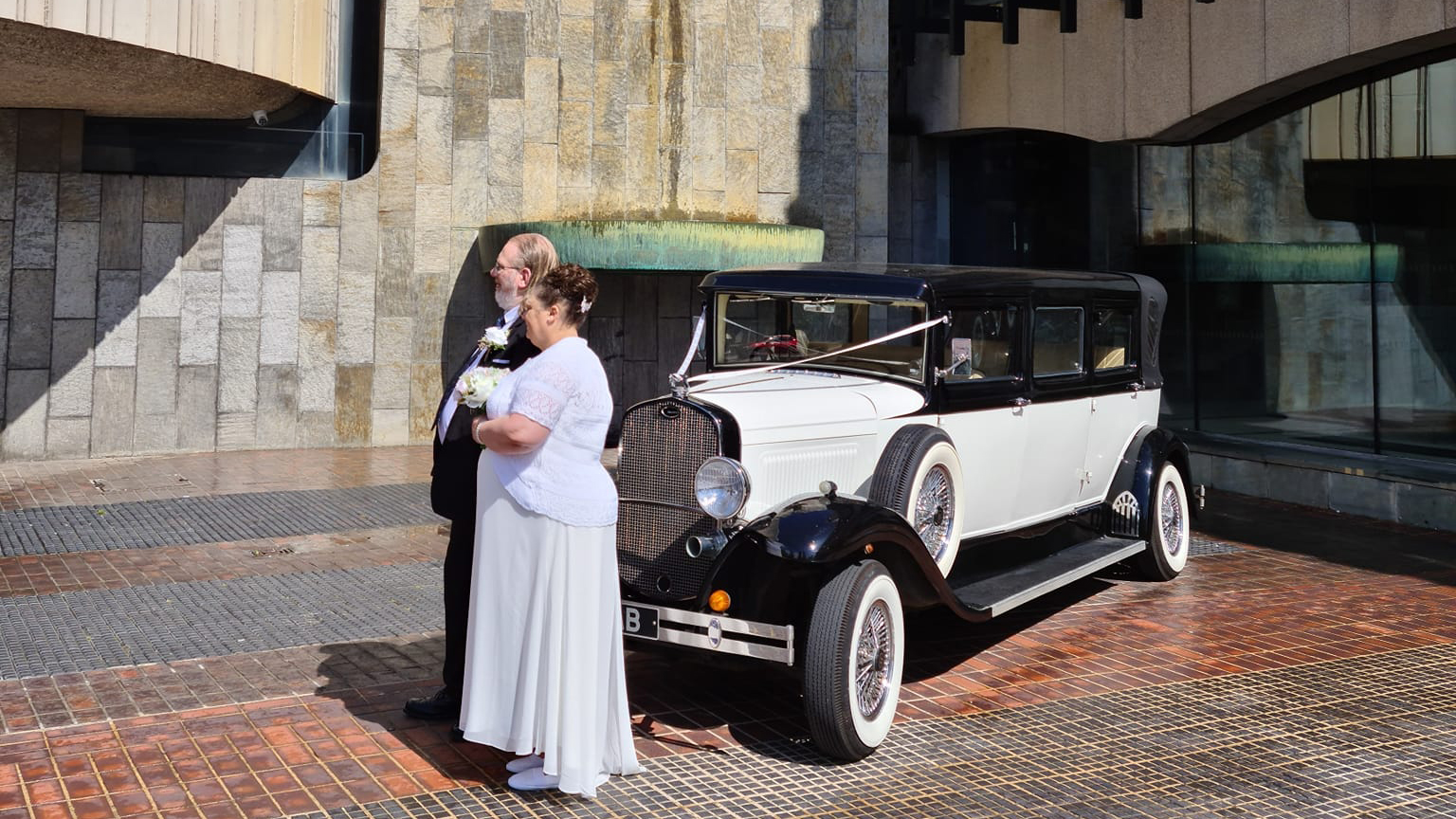 vintage Bramwith with couple in front of registry office in Newcastle