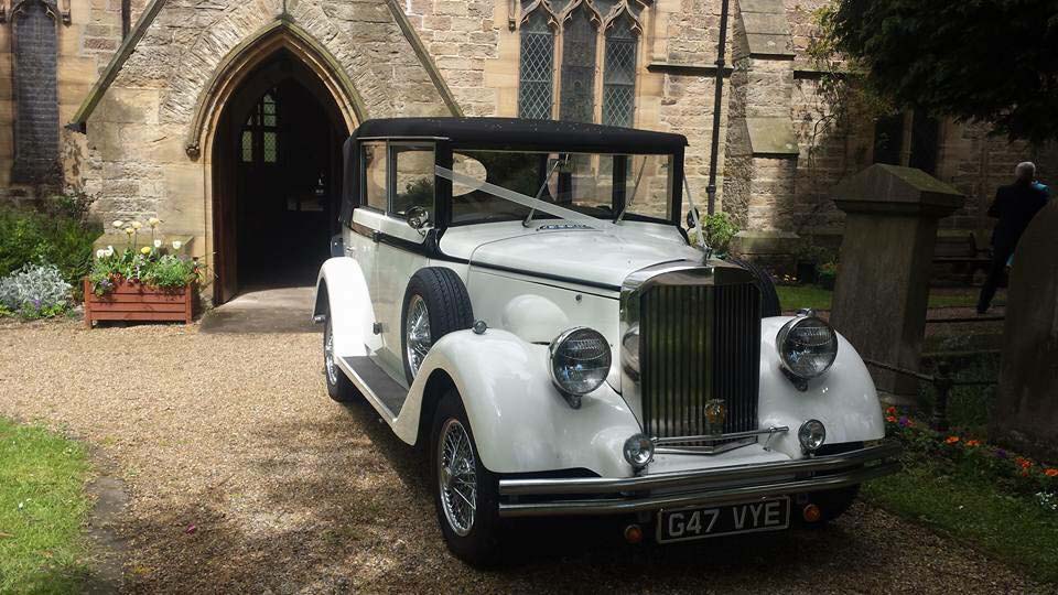 Regent Convertible with wedding ribbons parked in front of a church in Newcastle