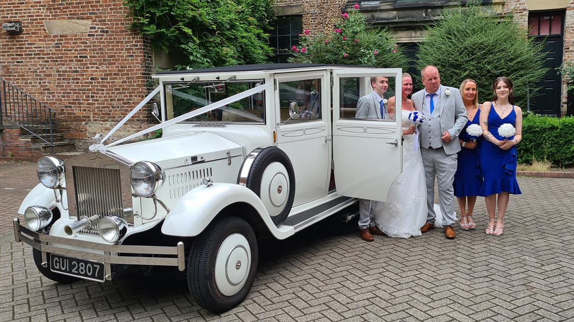 White Imperial with Bride, Parents and Bridesmaids wearing Royal Blue dresses