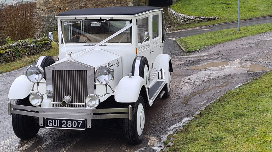 White Imperial Convertible with white ribbons