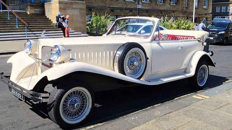 Beauford with soft top convertible roof down