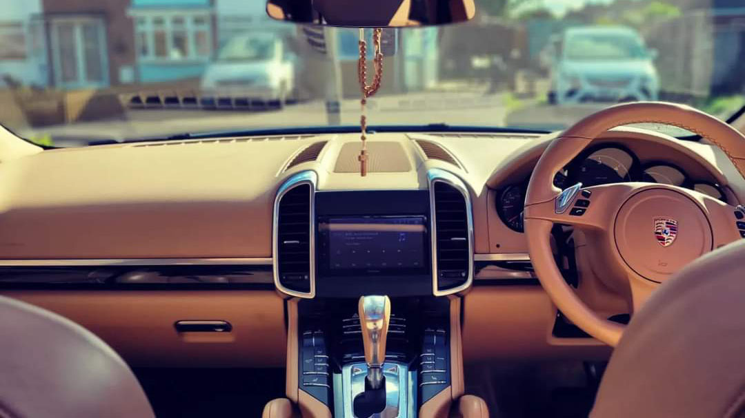 front view of dashboard from the rear seats inside Porsche