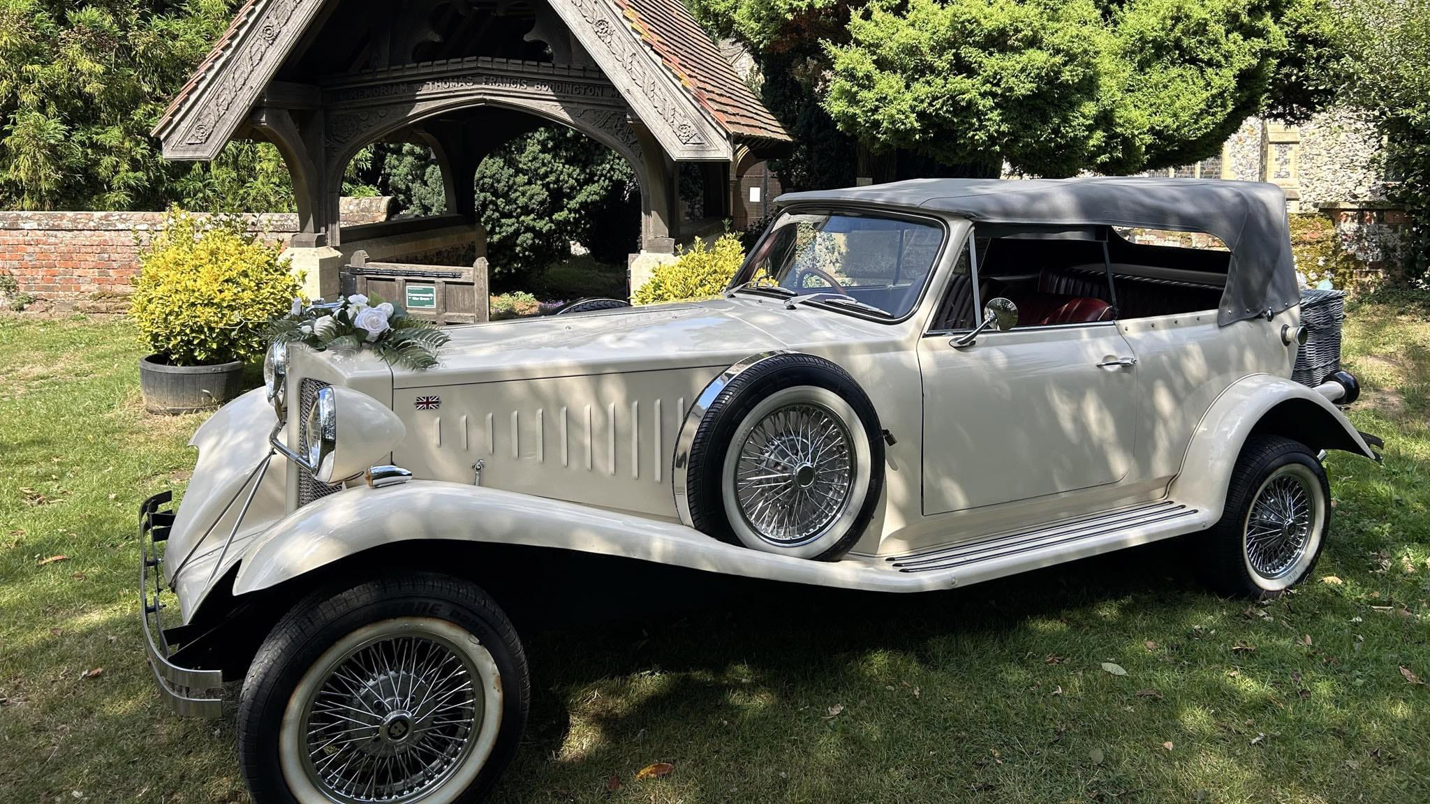 Left side view of Ivory Beauford parked in front of a church. White wall tires with spokes wheels