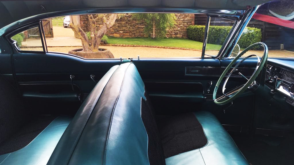 interior in Cadillac in Aqua Green and Black