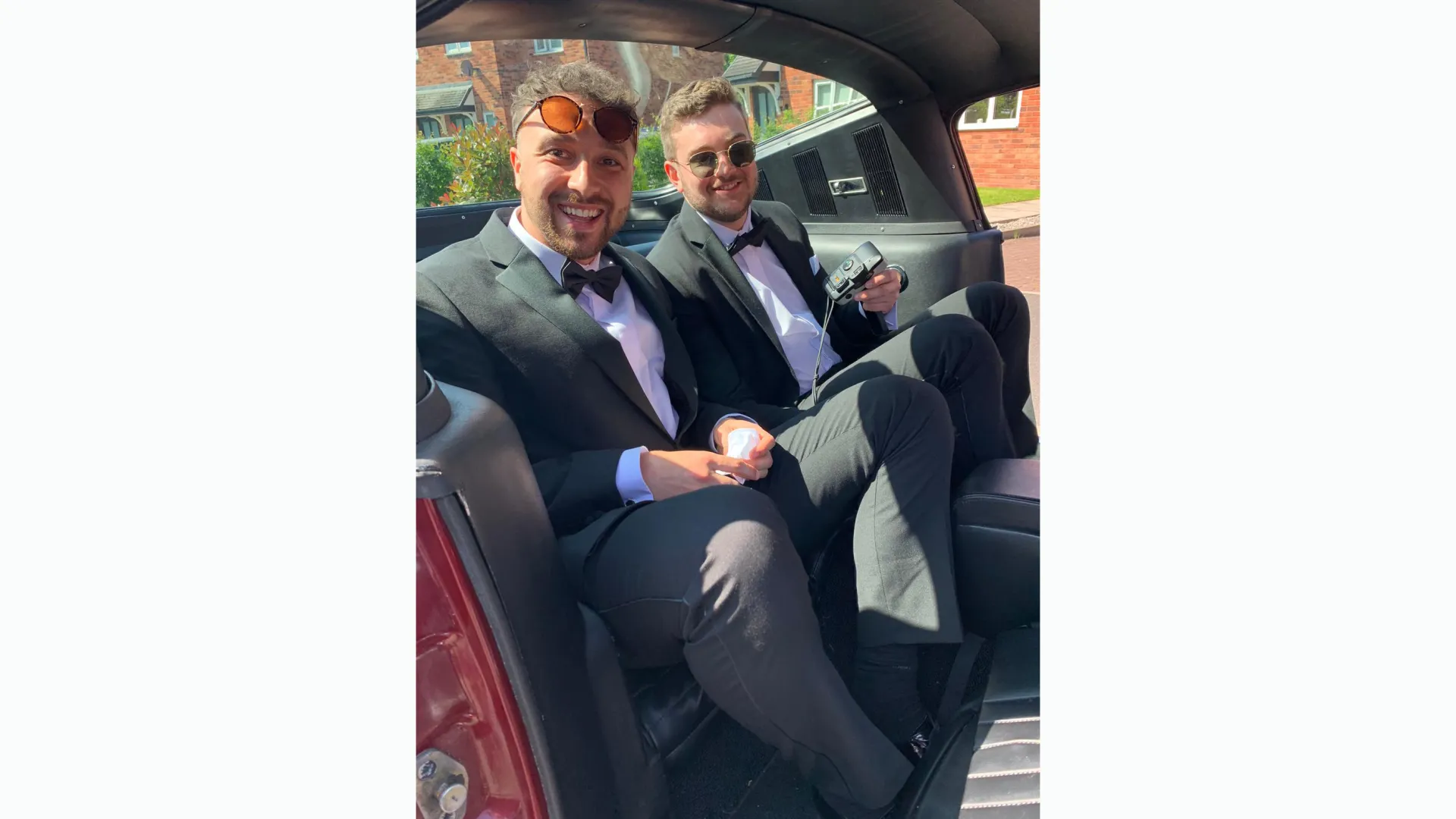 Groomand best man seating inside a Ford Mustang