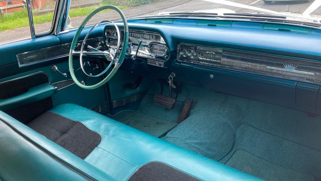 Front bench seat inside Classic American Cadillac.