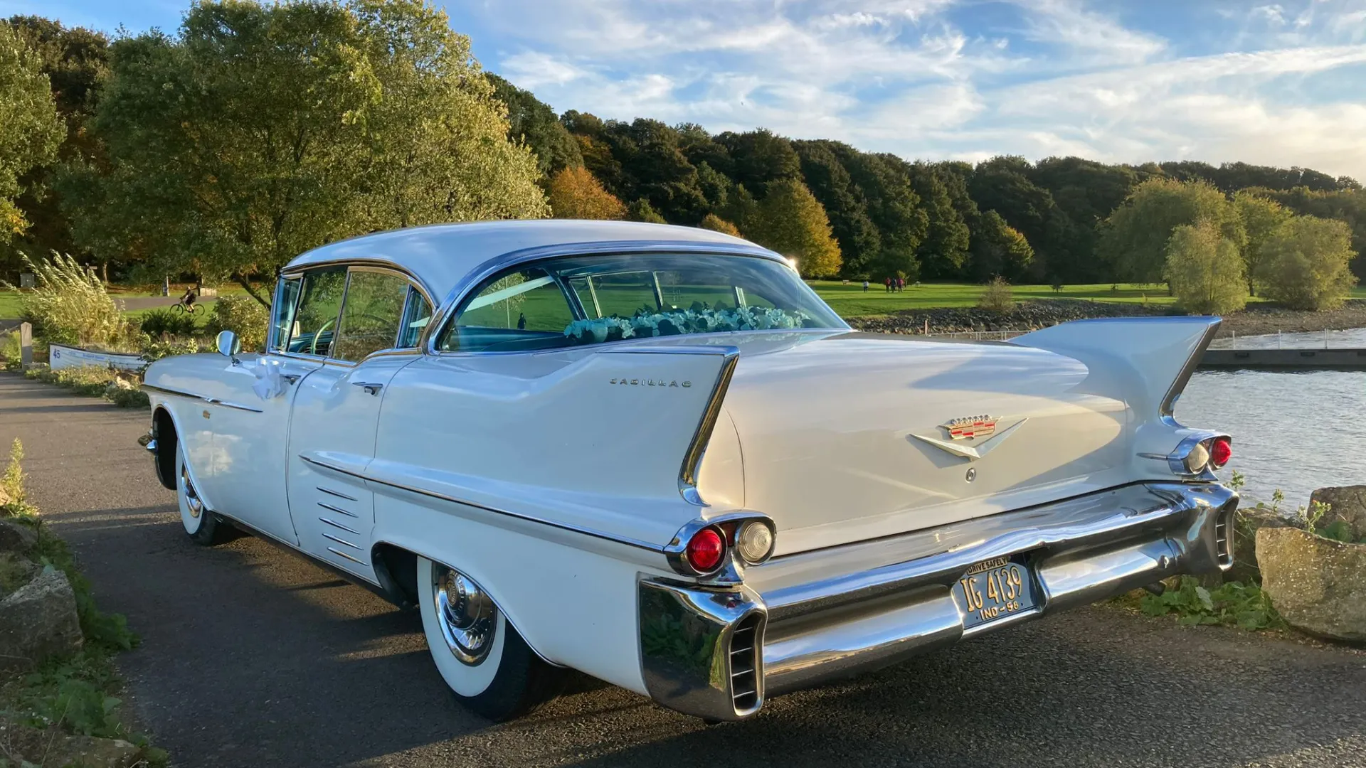 Rear view of White american car with thin tail