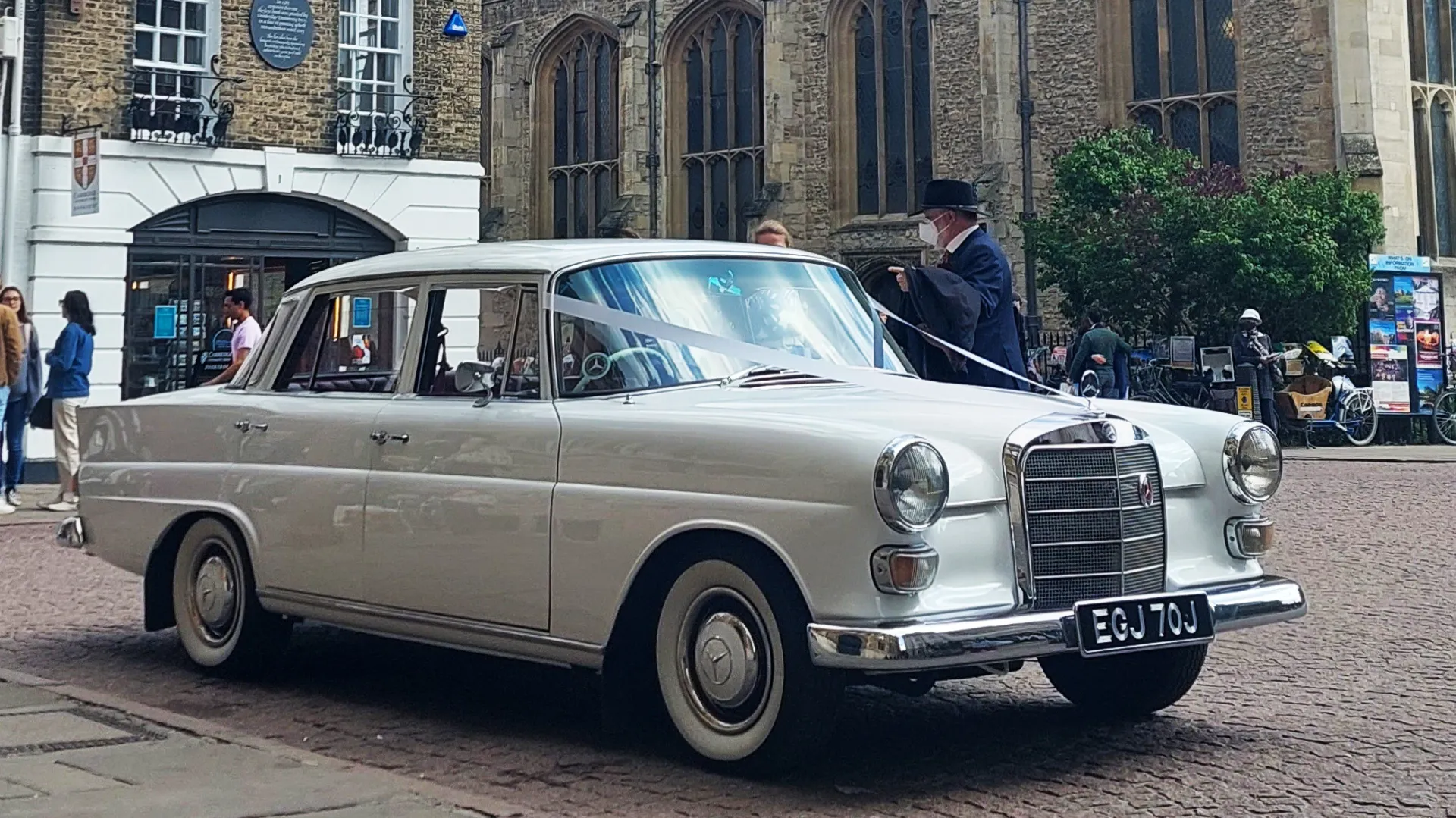 White Mercedes Fintail parked in street of Hatfield