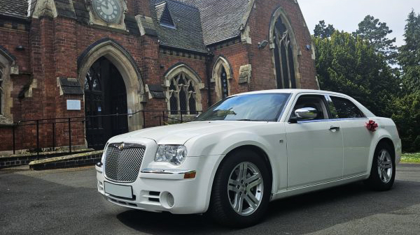 White 300c Chrysler Wedding Car in front of wedidng venue