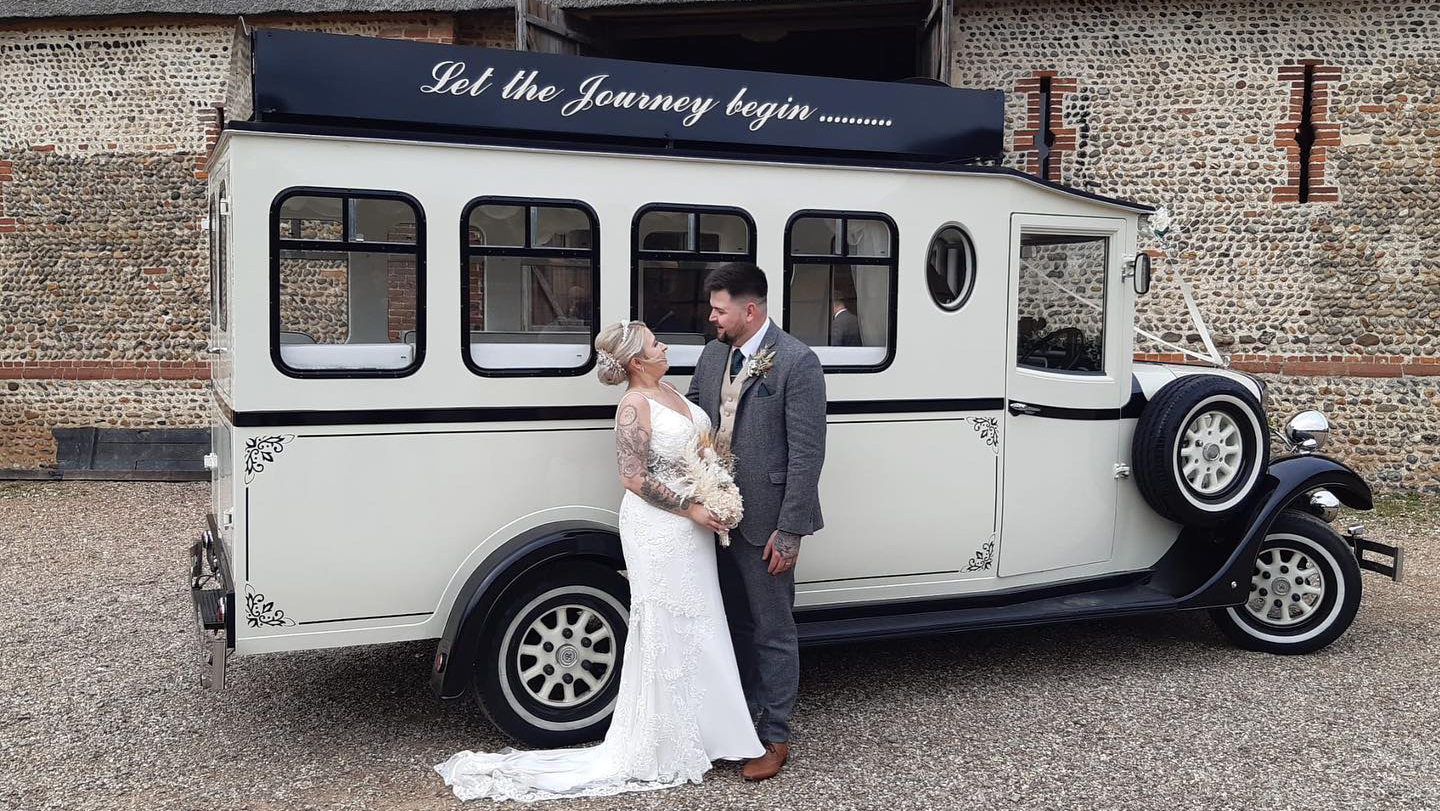 Bride and Groom in front of a Vintage Style Asquith Bus in Black & Ivory