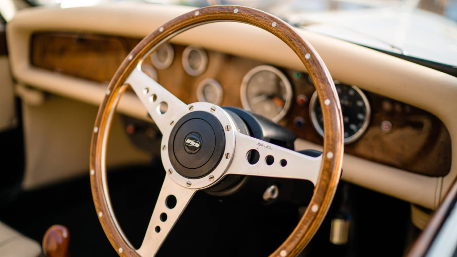 Front wooden dashboard and steerring wheel inside Beauford.