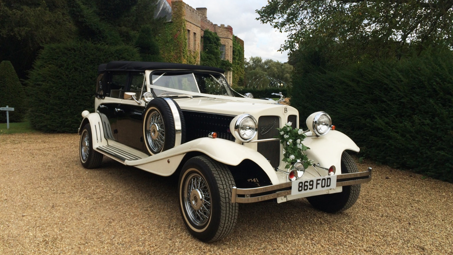 Front Right view of Black & White Beauford convertible with spare wheel mounted on the right side of the car.