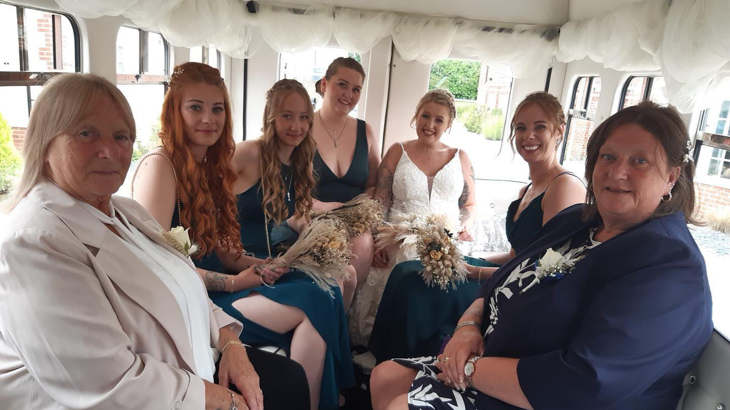 Large wedding party seating inside the vintag Asquith Bus