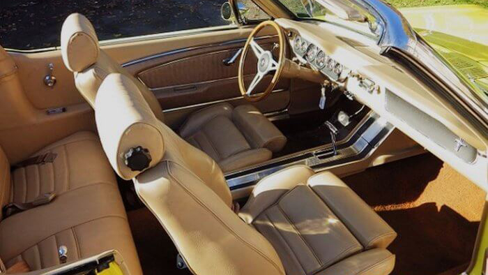 Aerial view of Cream leather interior inside a Classic Ford Mustang