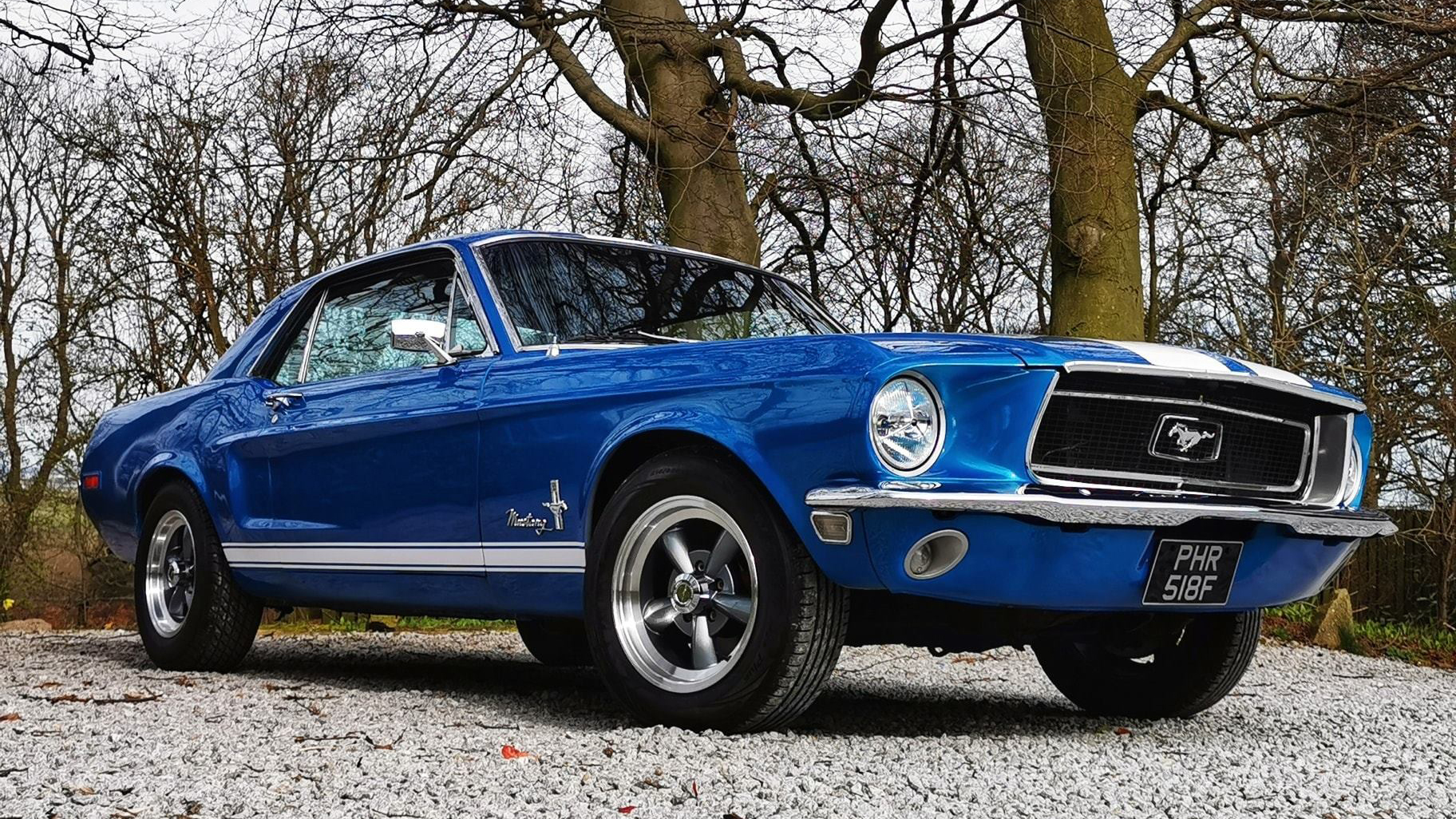 Classic Blue Ford Mustang with chrome wheels