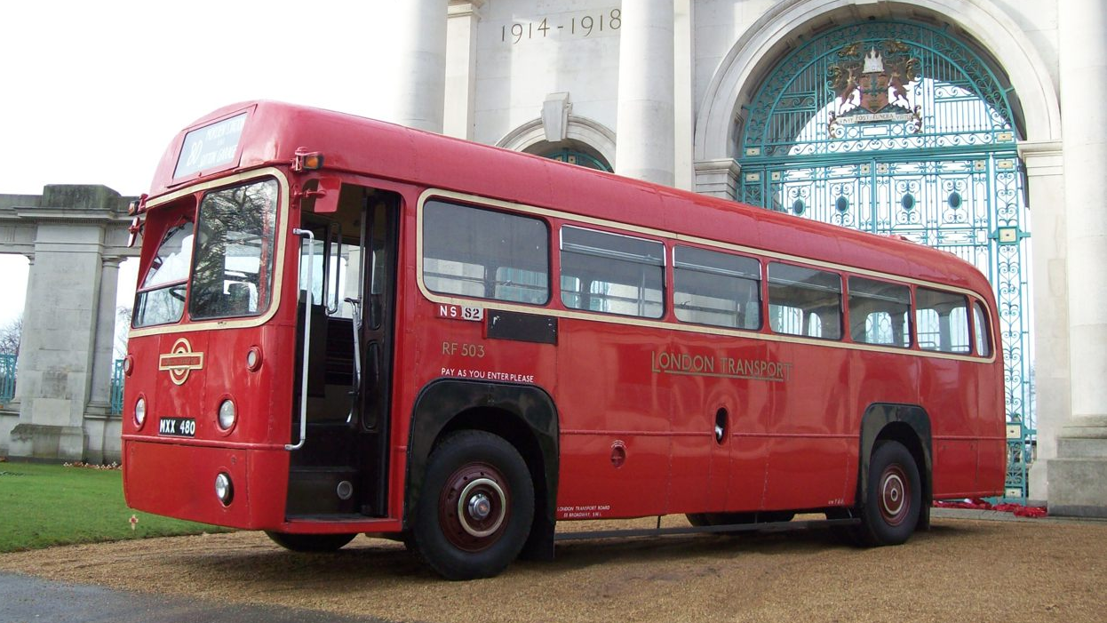 Left side view Red Bus with front passenger door open