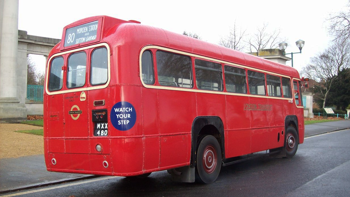 Rear right view of classic red bus