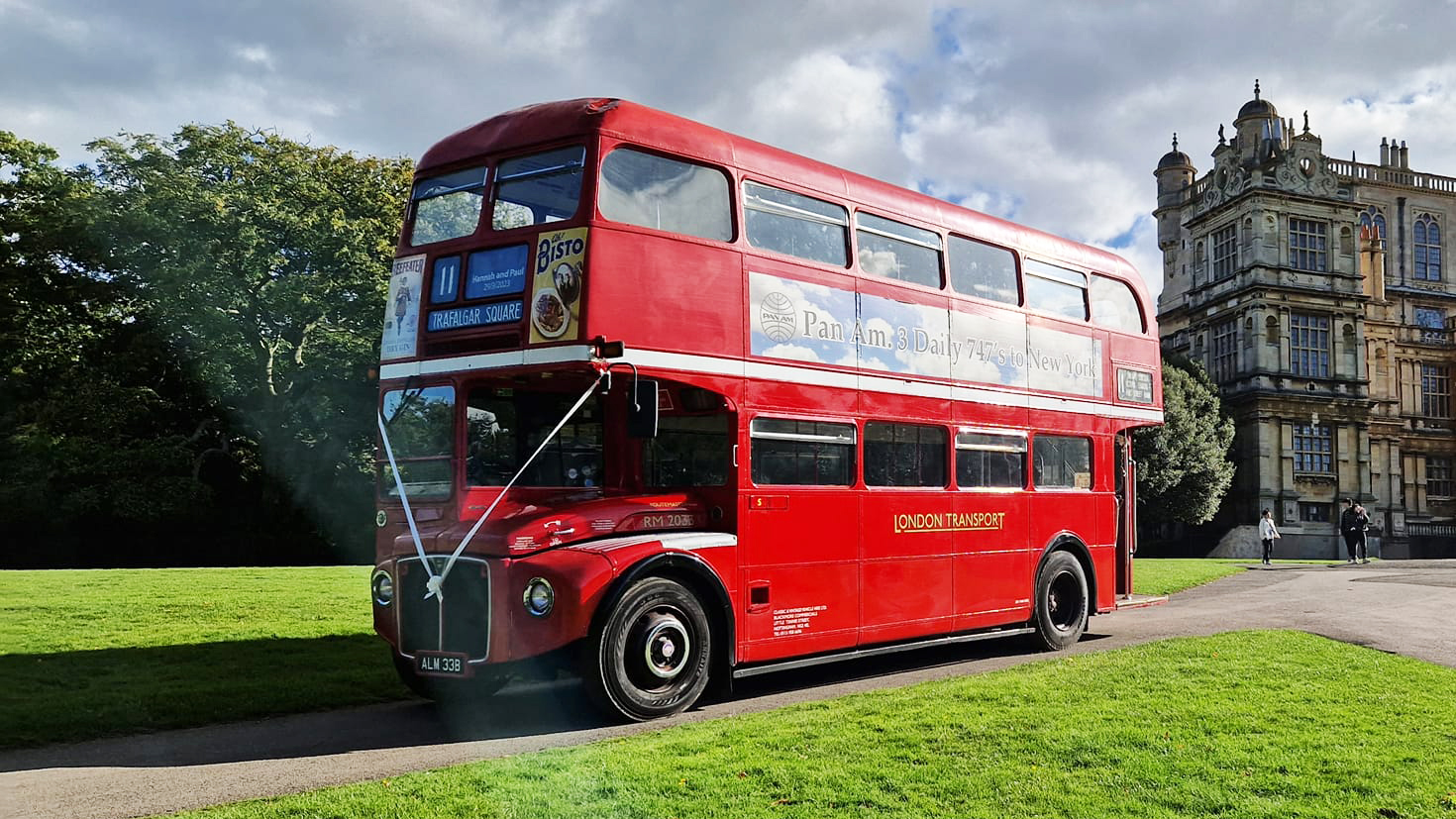 Classic Red Double Decker routemaster bus with vintage advertising on its left side