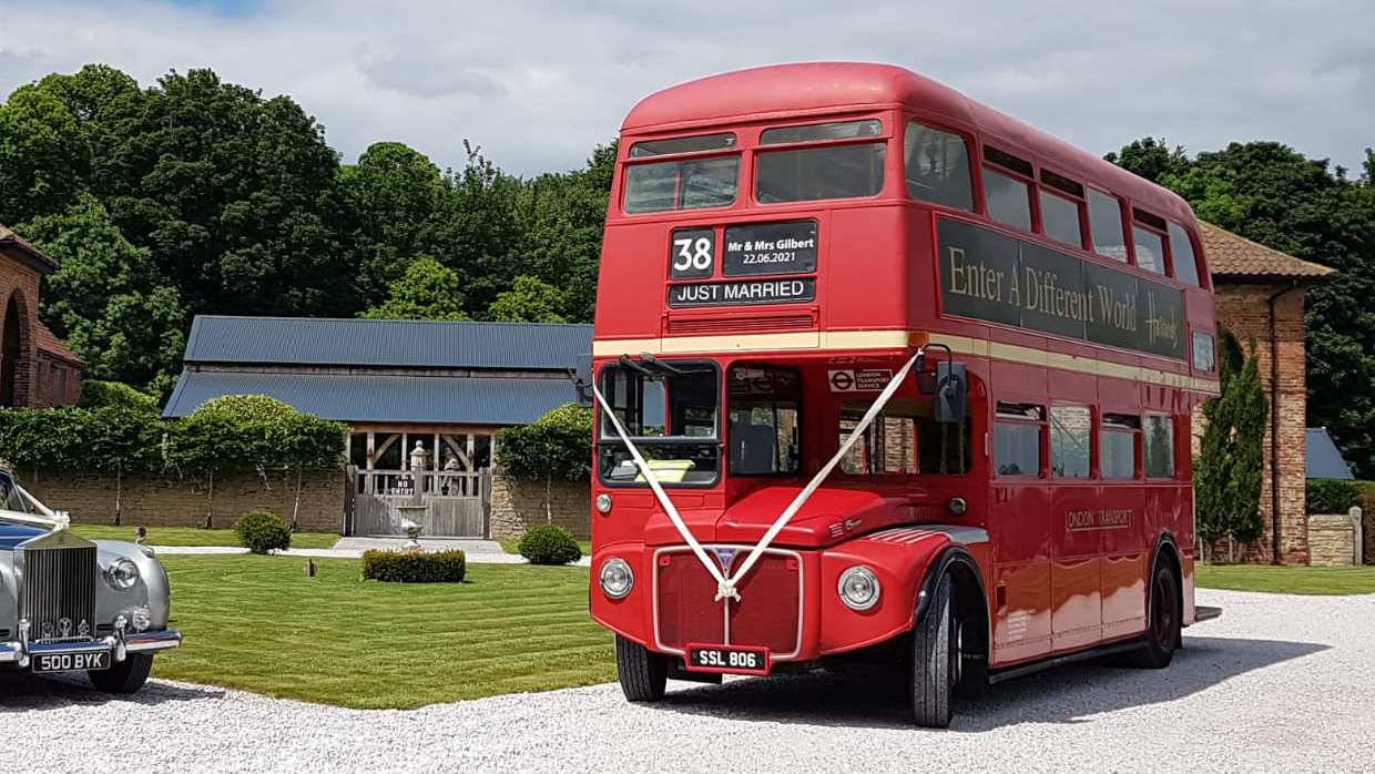 Vintage Red Routemaster bus with White ribbons