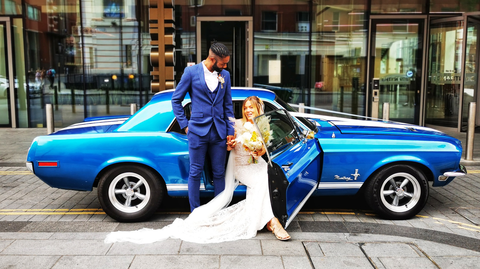 Bride and Groom with Classic Blue Ford Mustang