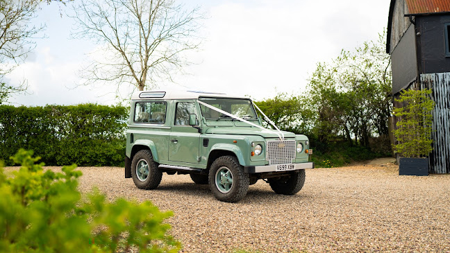 Green Classic defender 90 decorated with white ribbons