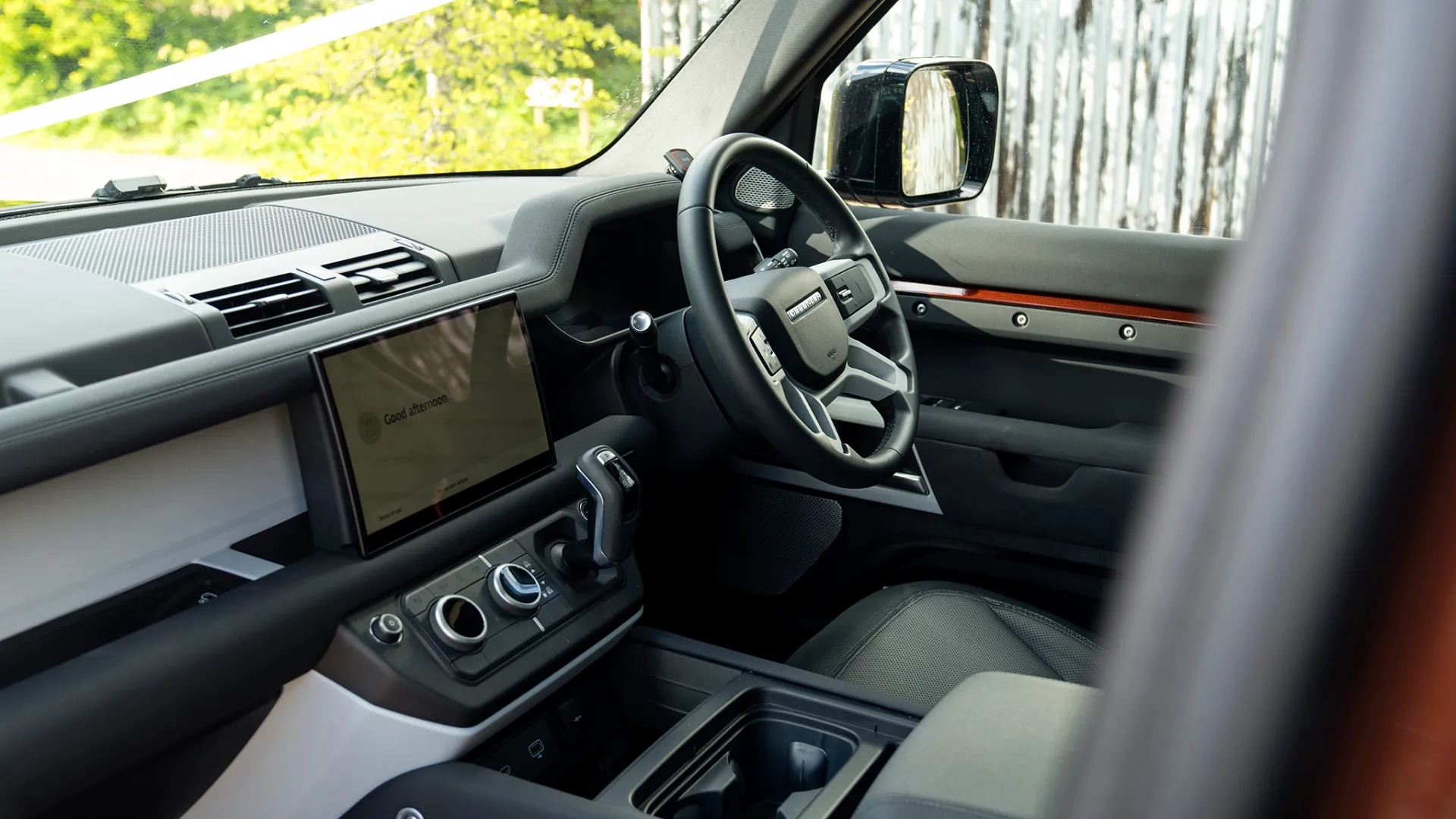 Black leather Front interior inside Modern Landrover Defender with Dashboard