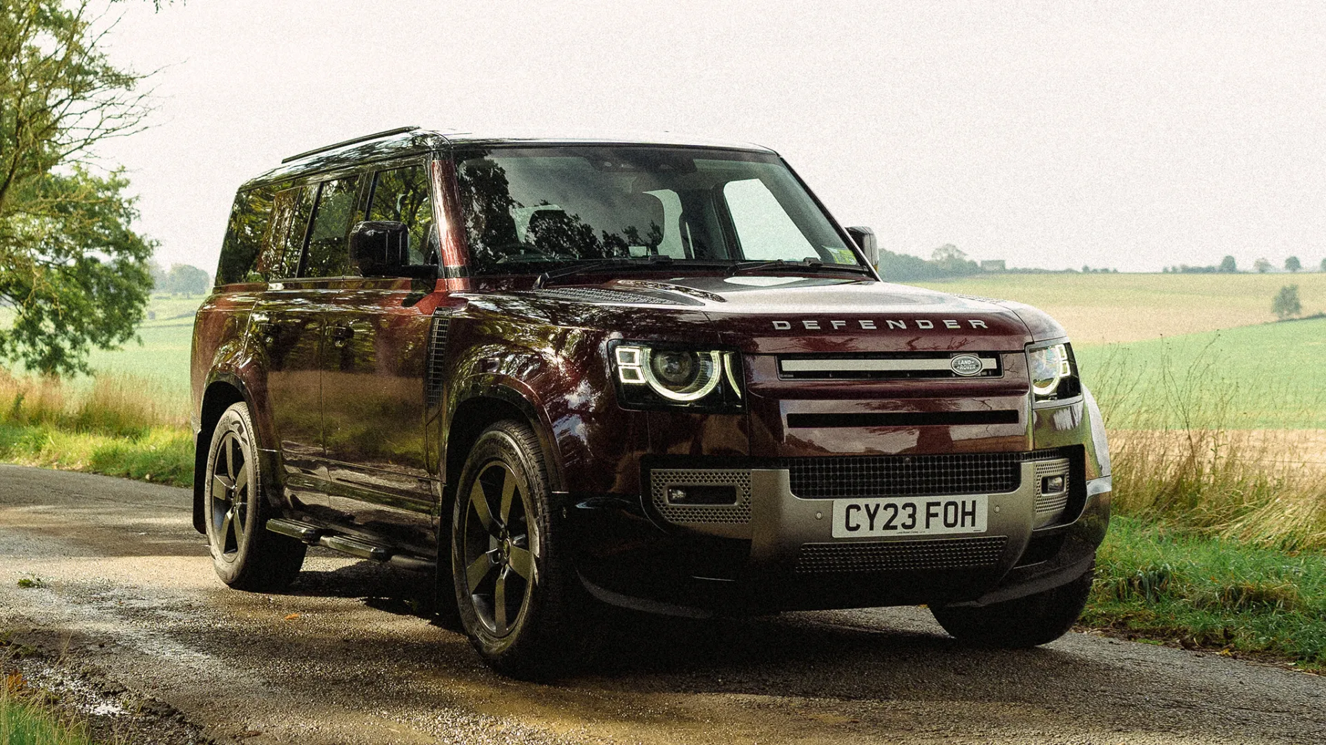 Modern Land Rover Defender 130 in Sedona Red front view