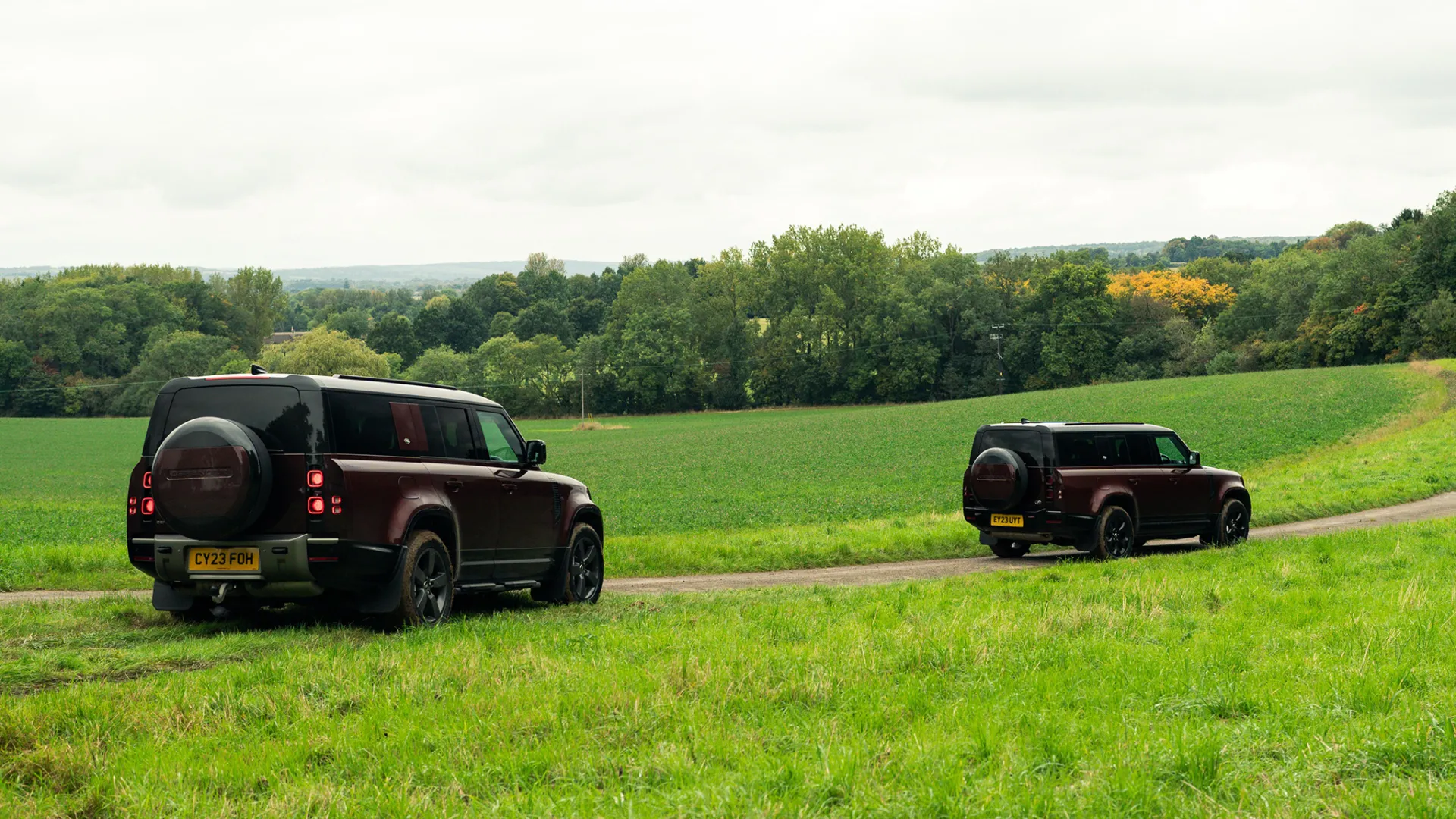 Rear View of Two identical LandRover defender following each others