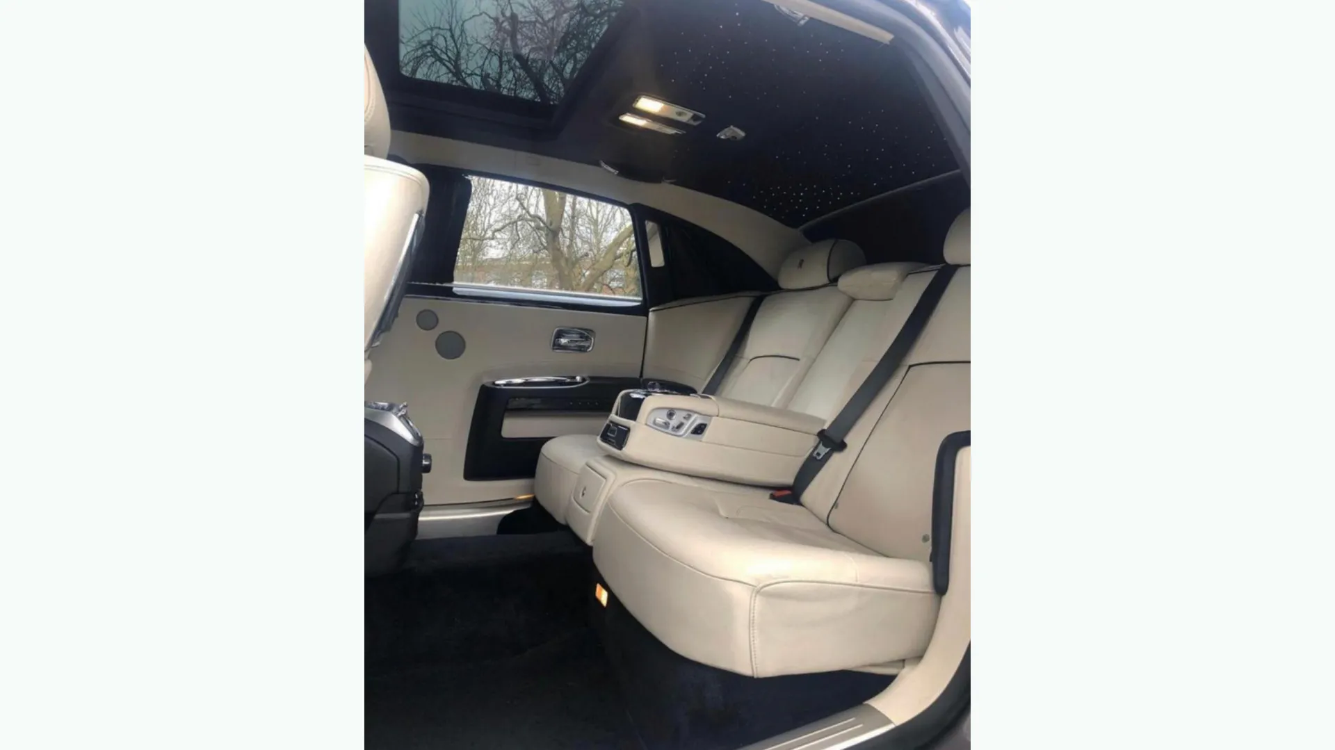 rear interior cream leather interior inside Rolls-Royce ghost with sunroof