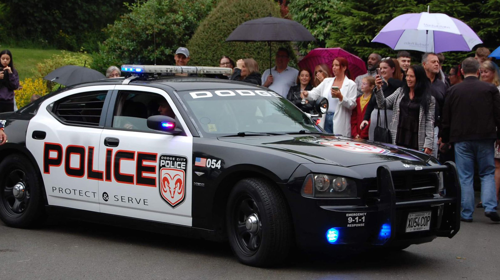 police Car Dodge Charger at a wedding. Wedding Guests can be seen in the background