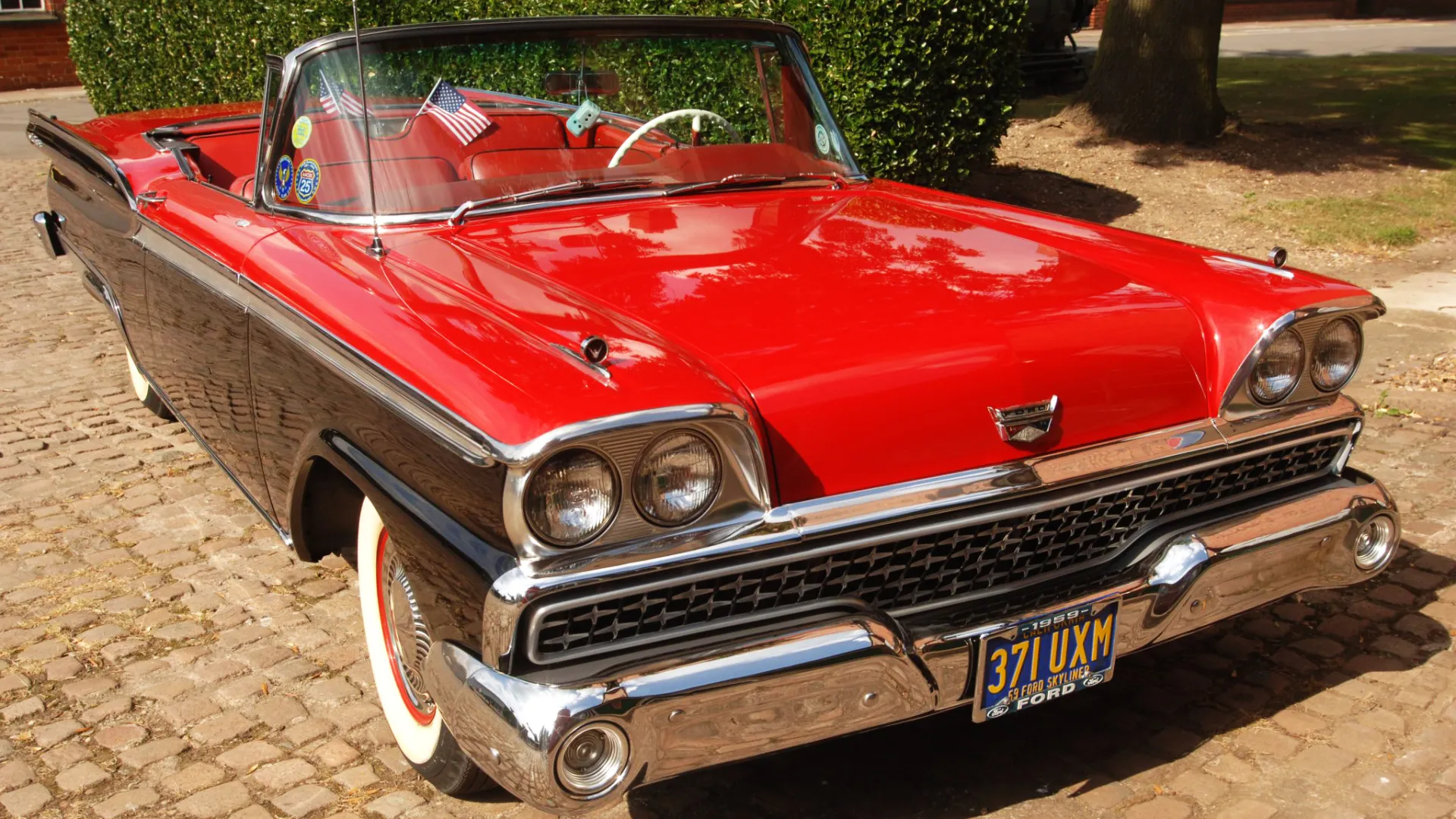 Classic American Ford Fairlane in Black with Red Bonnet and convertible roof down