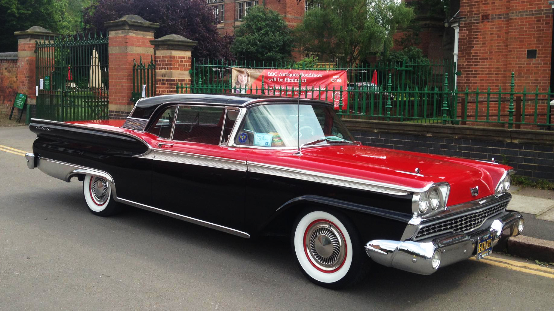 Right side view of classic american Ford Fairlane in Black and Red