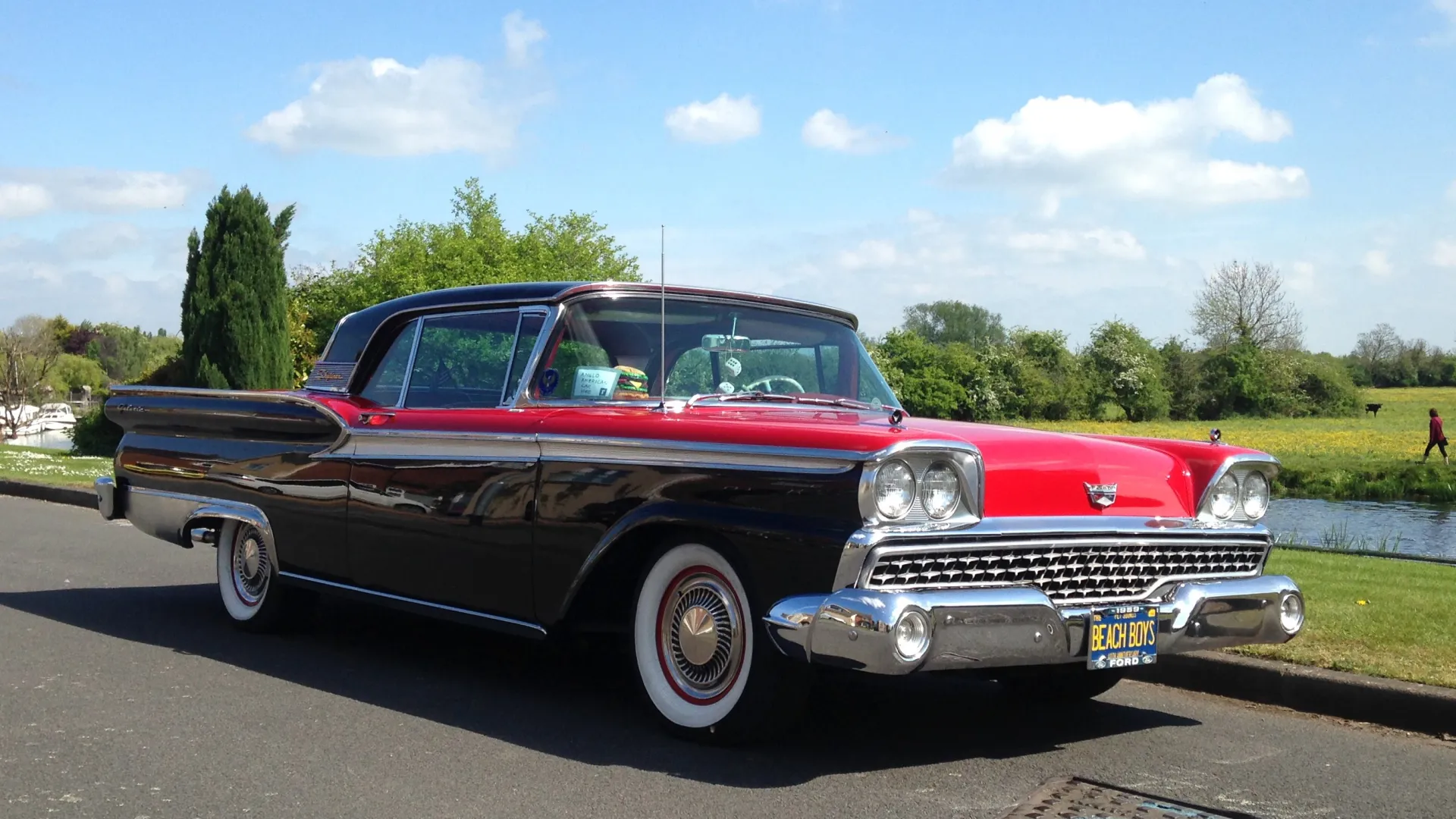 Black and Red American Classic ford Fairlane Skyline with large banded white wall tires.