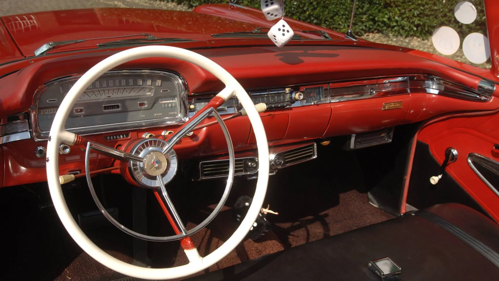 Red front dashboard of a classic American Ford Fairlane Skyline