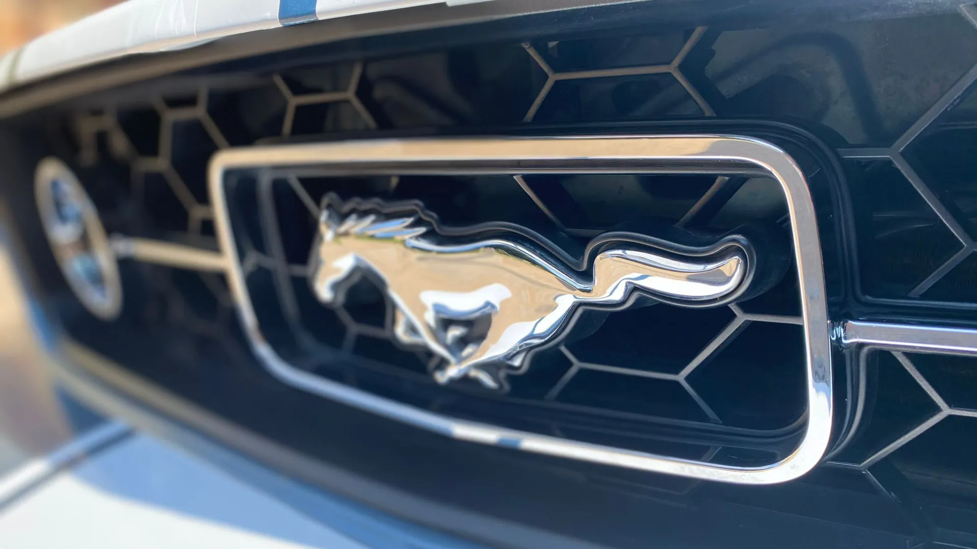 Chrome Mustang Pony Logo on front black grill