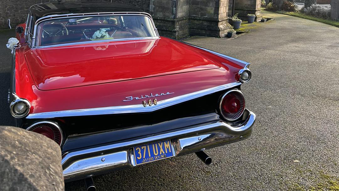 Rear view of classic Ford fairlane Skyline with large chrome bumpers