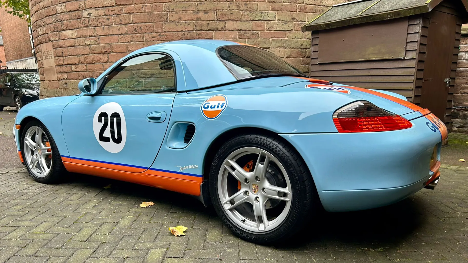 Left Side view of Porsche Boxster with Number 20 logo on the side of the door