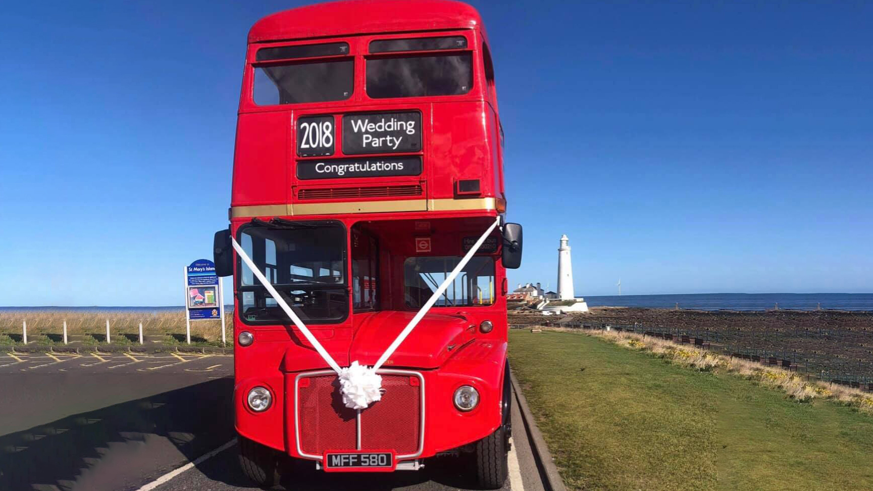 Front view of red Double Decker Routemaster bus parked by the sea side in Tyne and Wear